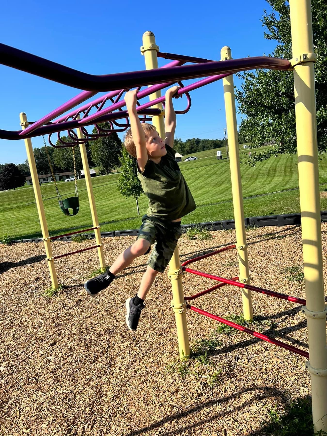 Child on monkey bars